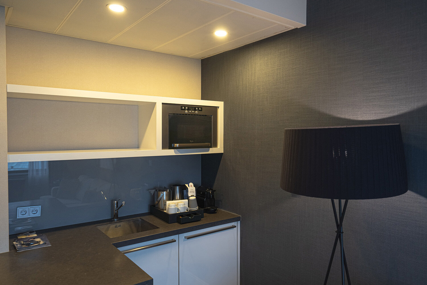 Microwave, sink and coffee machine in the living area
