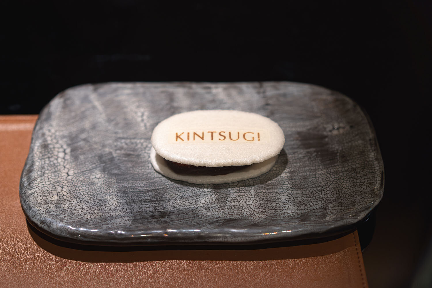  “Kin Kat”—chilled roasted foie gras and cognac in a dark chocolate shell sandwiched between a crisp monaka wafer 