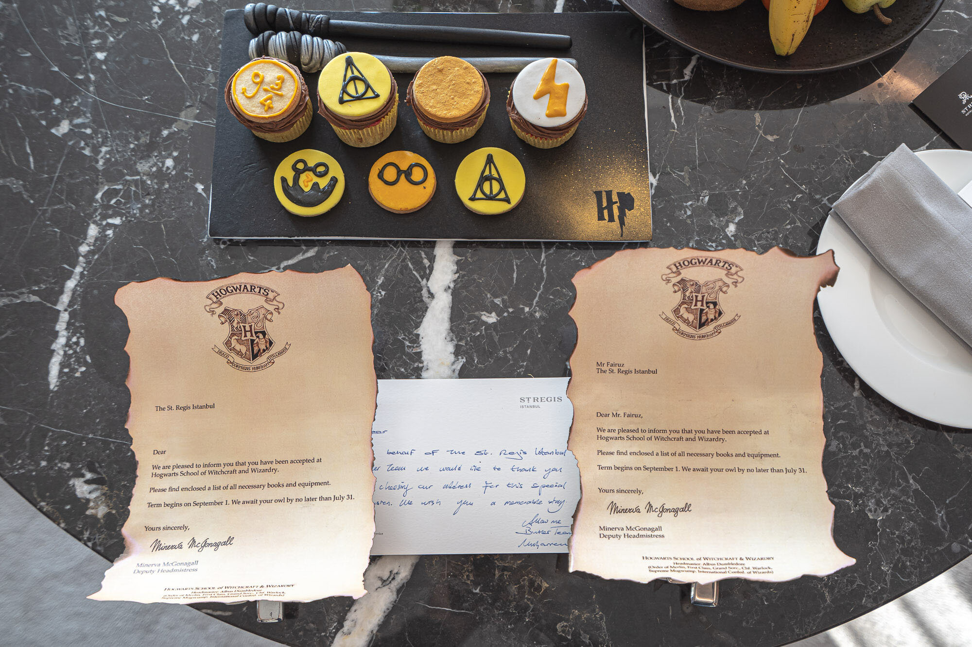 Admission letters, cupcakes and wands