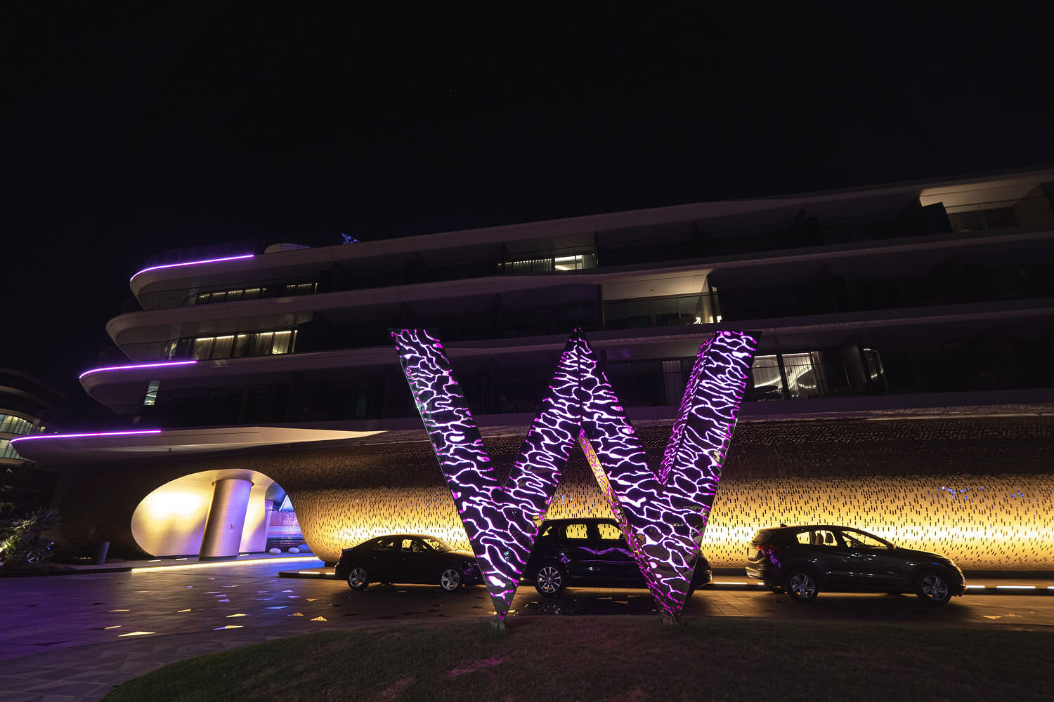  W logo outside the building at night 