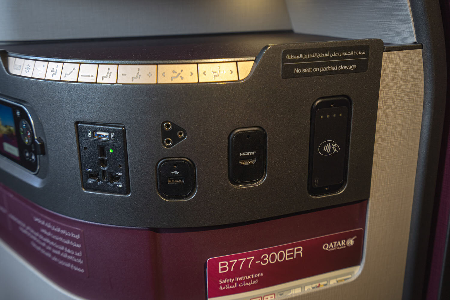 Seat controls, universal power socket, HDMI and 2 USB ports