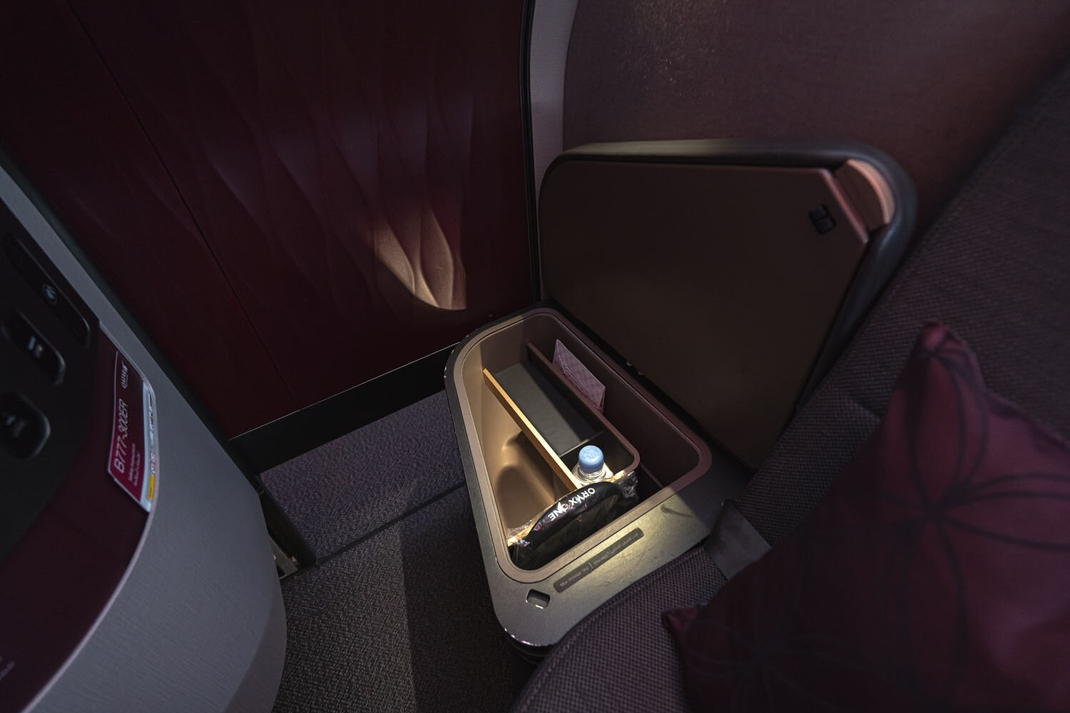 Small compartment by the seat. Also note that the sliding door does not go all the way down.